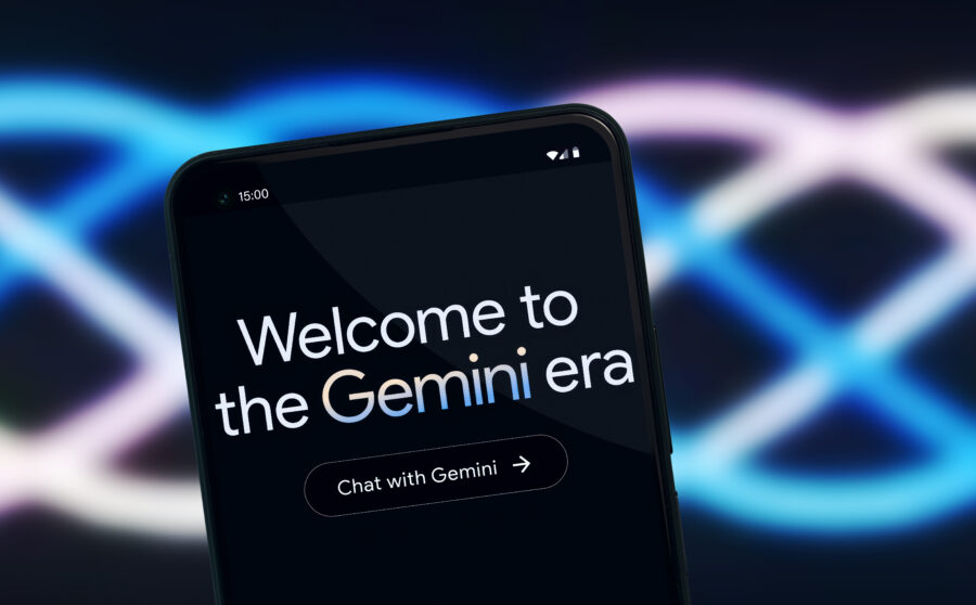 A smartphone screen displaying the message "Welcome to the Gemini era" with a "Chat with Gemini" button, against a blurred background of intertwined blue and purple neon lines.
